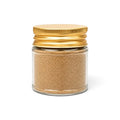 Black summer truffle powder (Tuber aestivum) in a clear glass jar with a yellow lid
