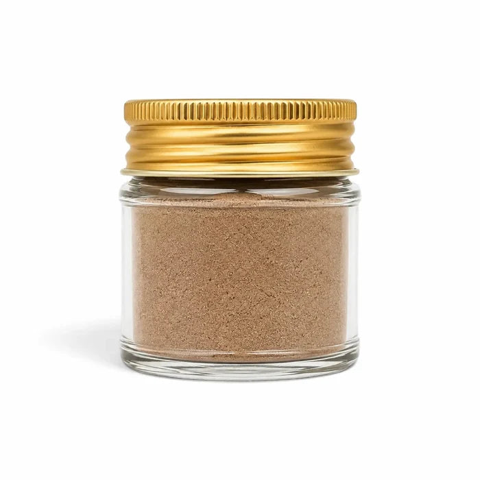 Black Winter Truffle powder made from Tuber brumale in a clear glass jar with a yellow lid