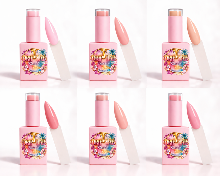 Set of pink nail gel polish bottles with colorful labels on a white background