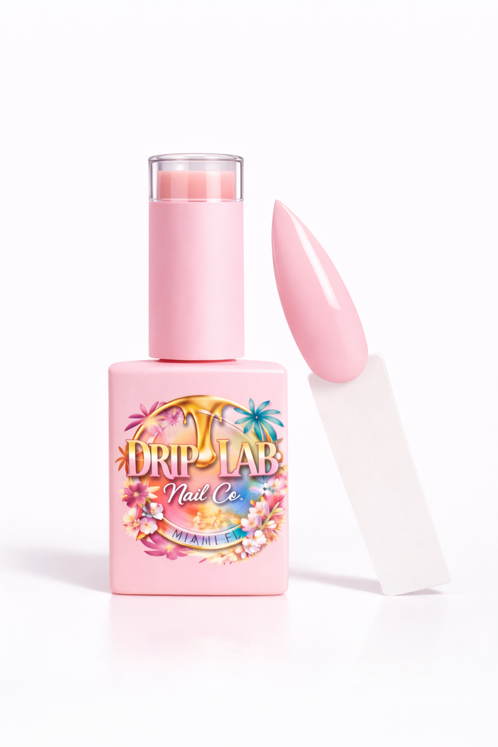 Pink nail gel polish bottle with a matching nail cap on a white background