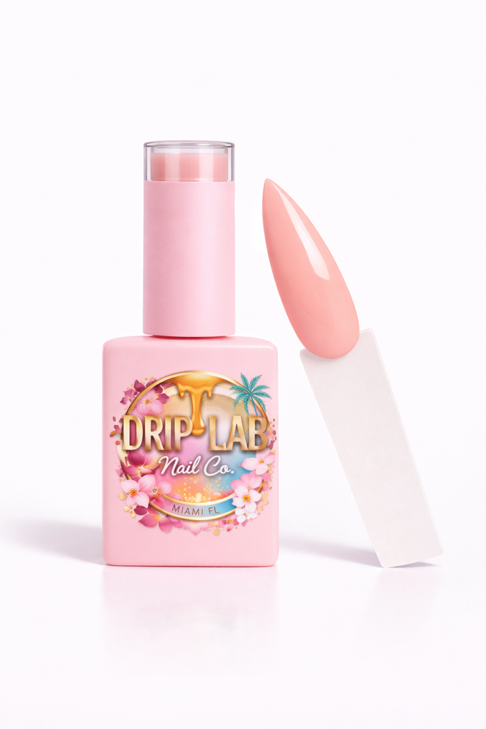 Pink nail gel polish bottle with a matching nail on a white background