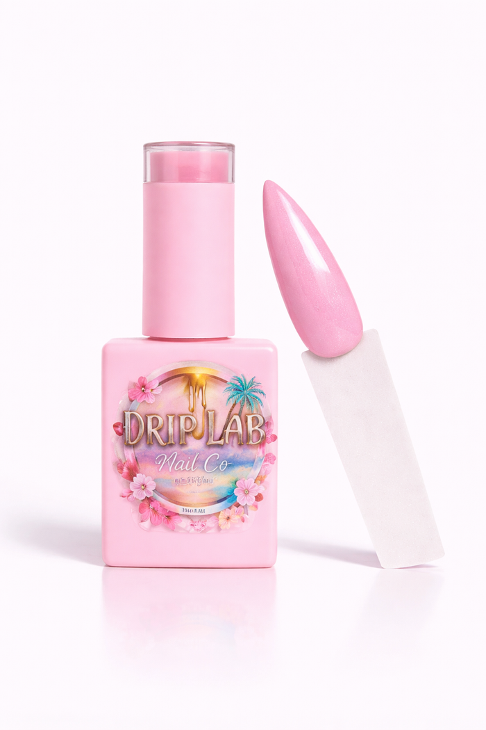 Pink gel nail polish bottle with applicator on a white background