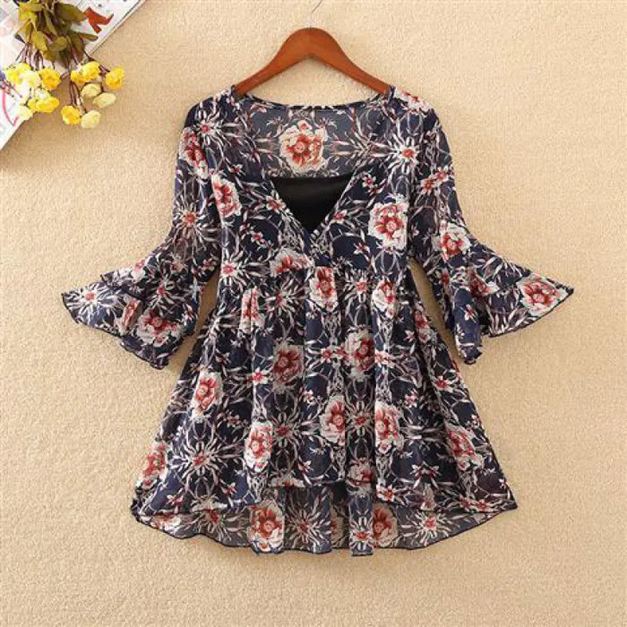 Woman wearing white floral chiffon blouse, lightweight summer top
