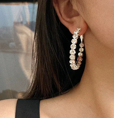Close-up of crystal stud earring sparkle