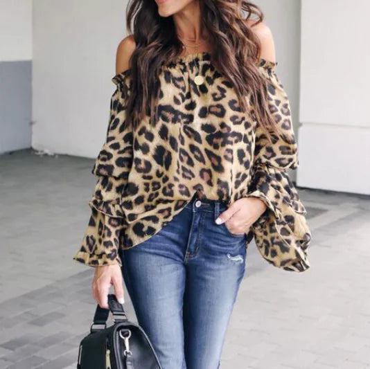 Detail view of the leopard print off-shoulder blouse