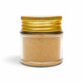 Morel powder (Morchella esculenta) in a clear glass jar with a gold lid