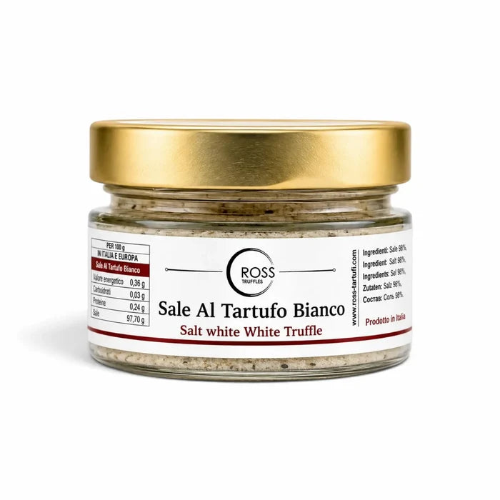 White truffle salt with truffle pieces in a 120 g glass jar with a gold lid