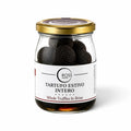 Whole Tuber aestivum summer truffles preserved in brine in a glass jar
